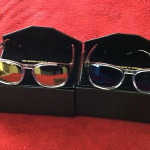 Two pair of reading sun glasses
